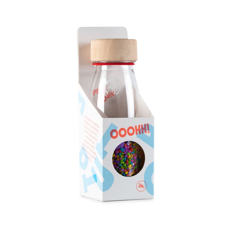 petit boum sensorische fles gevuld met kleurrijke rijst en buttons om kinderen te laten schudden, luisteren en ontdekken